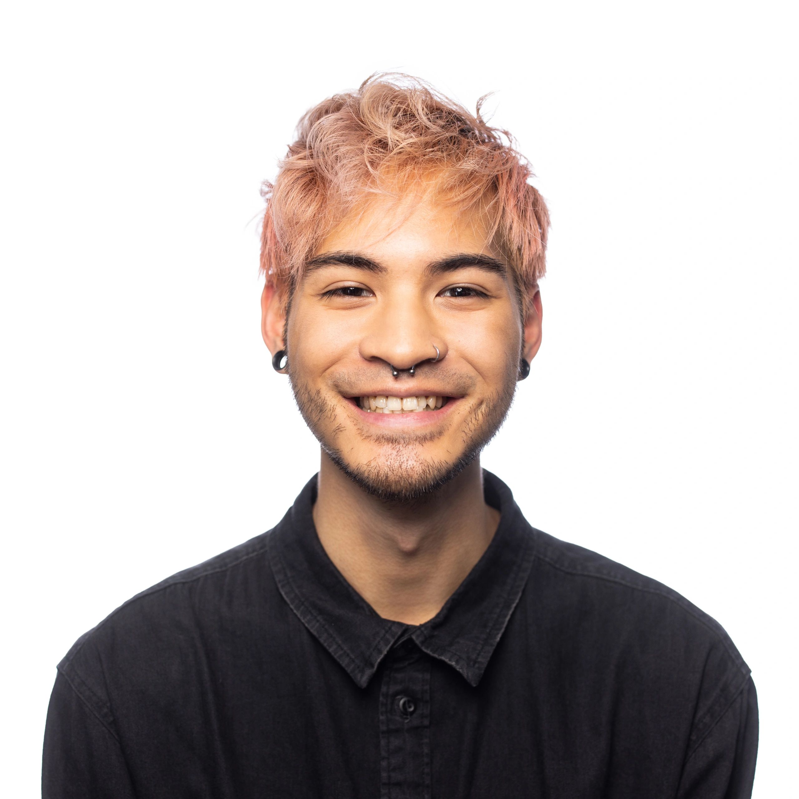 Portrait headshot of a smiling young adult