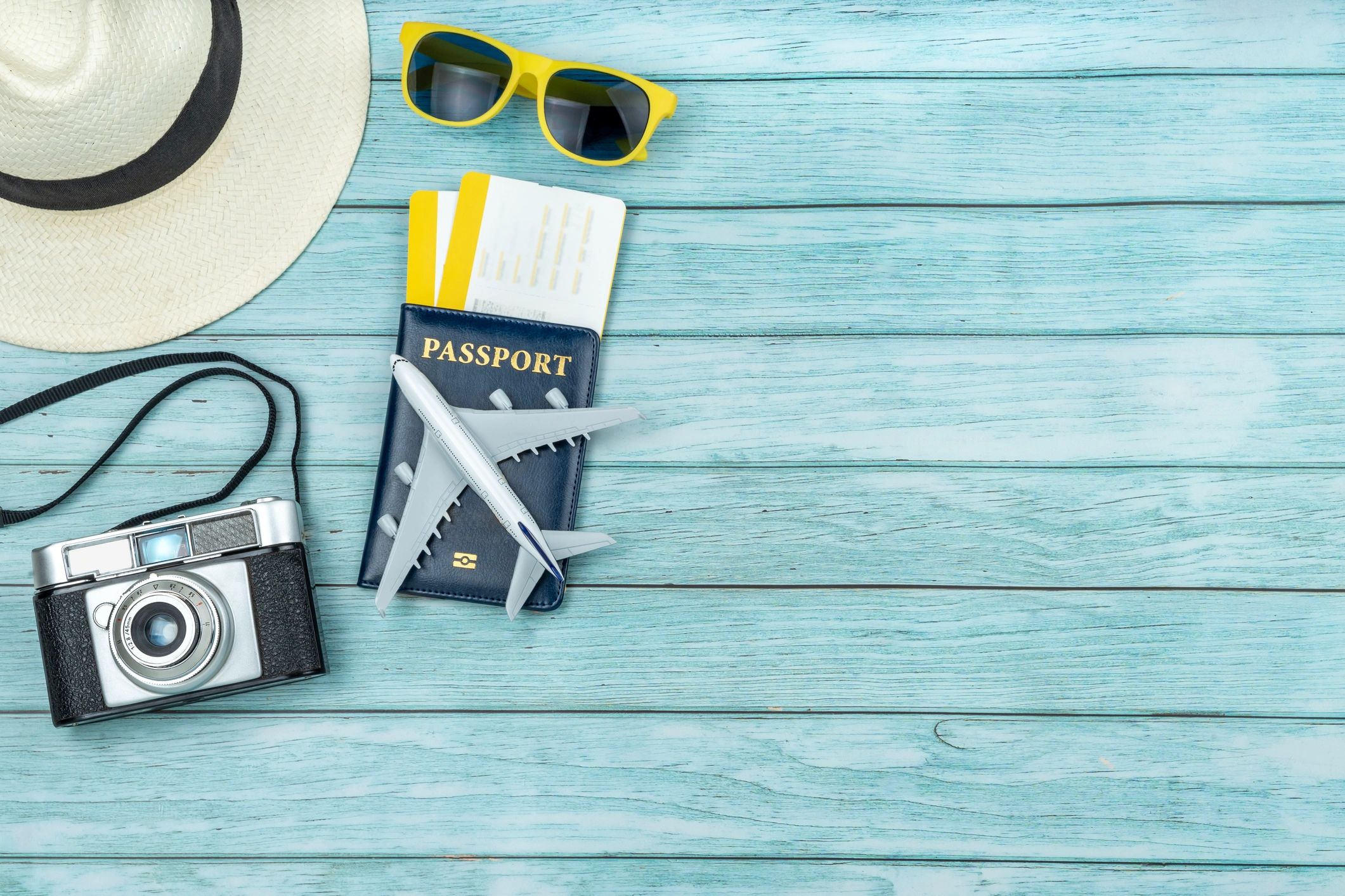 Passport and travel documents laid out on a desk